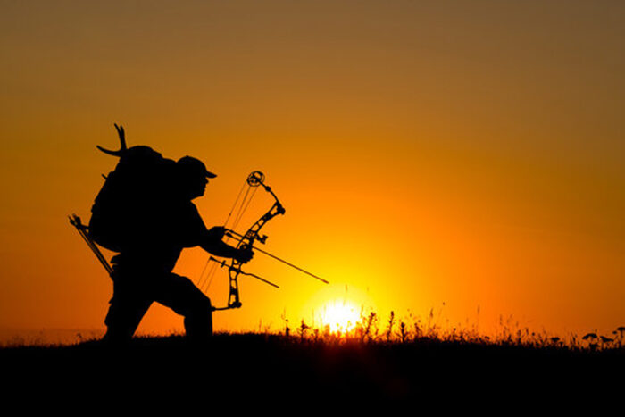 Bowhunter in Sunset