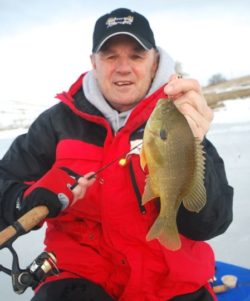 Gary Howey with one of the big bluegills caught while ice fishing a small pond in Nebraska.