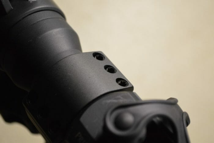 The sight tube is held secure by six hex screws divided in threes on the left and right sides of the sight