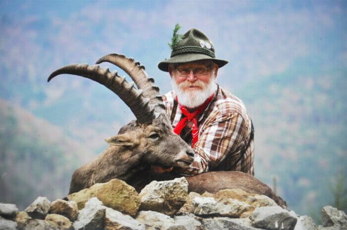 Larry poses his hard-won Alpine ibex on the hunt set up by Patty Curnuette with The Global Sportsman.