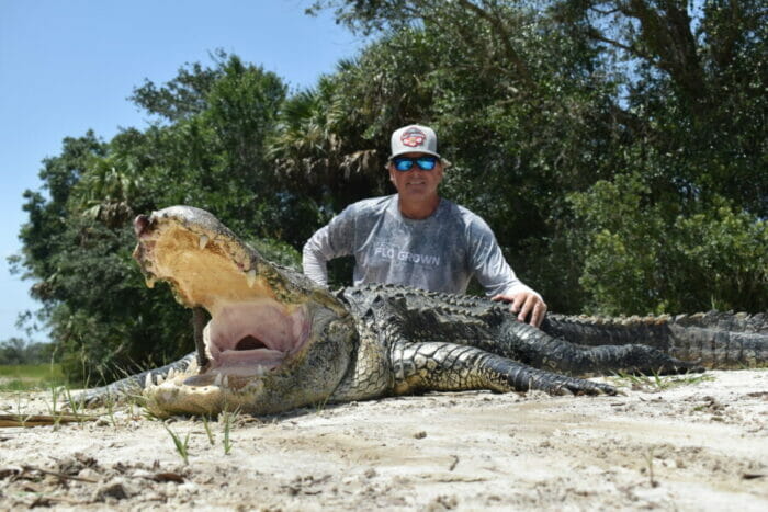 Bob Carnes with a ten foot 6 inch alligator taken with Florida Hunting Adventures
