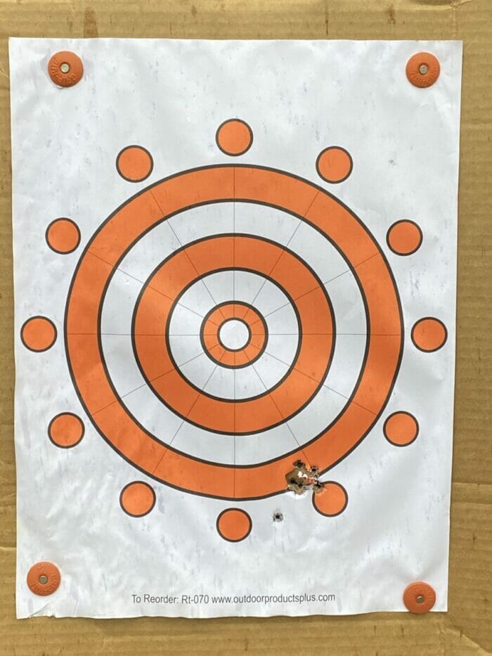 The first five shots with the UTAS UT9 Mini and an unsighted red dot all were within a quarter inch of center at 12 yards while standing.