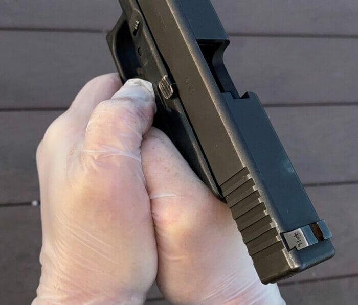 This was my former grip. Support hand thumb over the stong hand thumb. Magnum revolver shooters still use this grip to tame recoil.