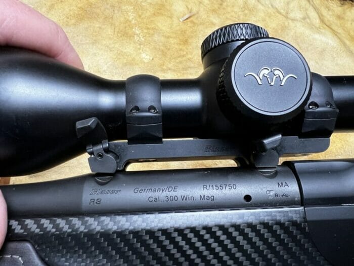 Simply flip the lockdowns open, and rotate clockwise, tilt the riflescope to the right and, voila!, the riflescope is released from the top of the chamber leaving only the grooves on left and right behind.