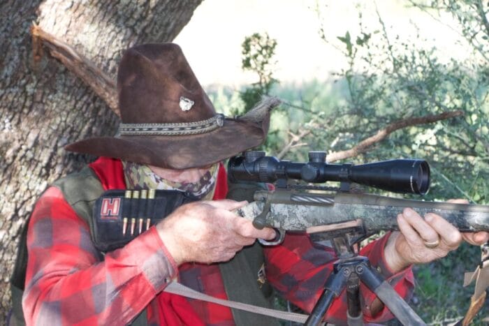 Larry takes aim at his buck, Mossberg Patriot Predator, 7mm PRC, Trijicon AccuPoint scope and shooting Hornady's 175-grain ELD-X Precision Hunter.