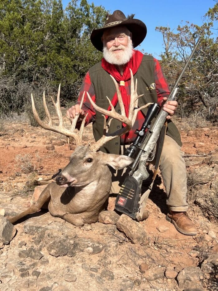 Larry shows off his Buffalo 4 Ranch whitetail buck...proudly I might add.